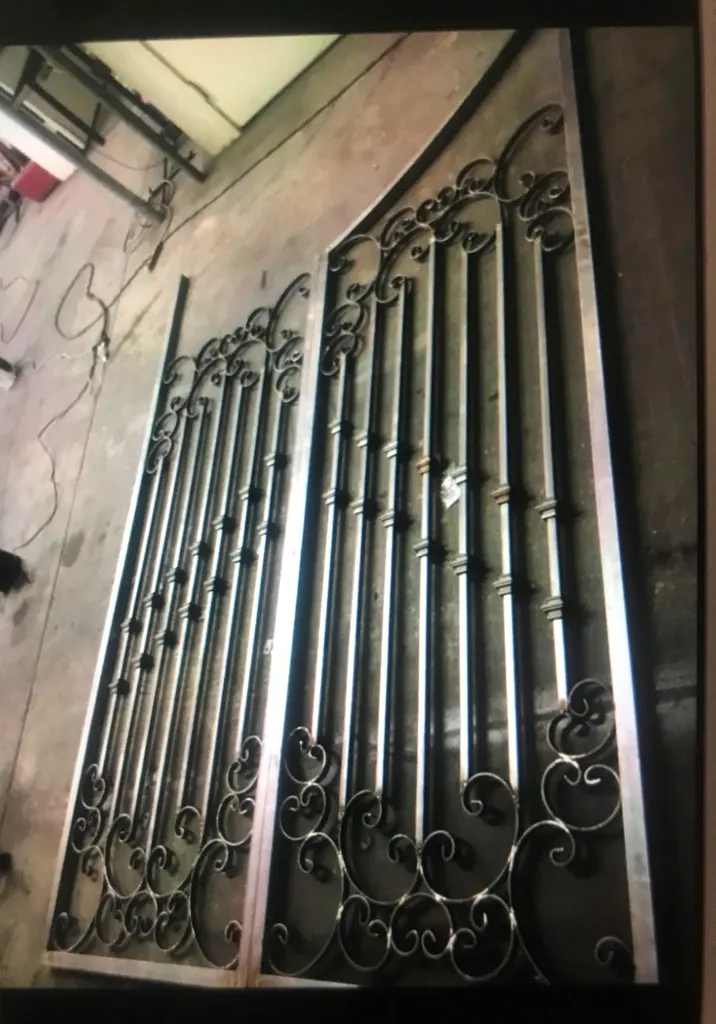 Steel courtyard gate with open ironwork by SG Fabrication