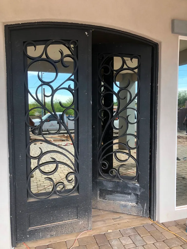 Custom steel entry gate fabricated and installed by SG Fabrication