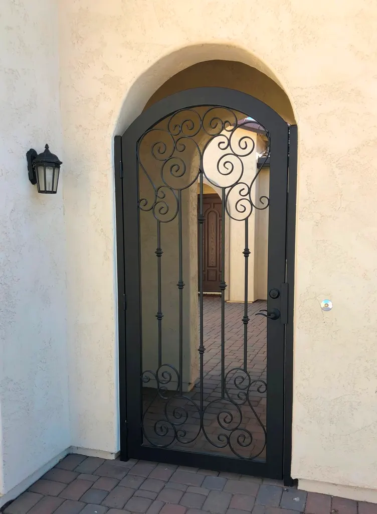 Iron entry gate detail from an SG Fabrication install